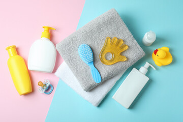 Obraz na płótnie Canvas Different baby hygiene accessories on two tone background
