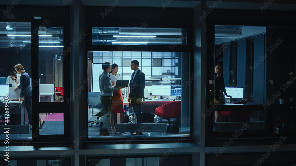 Aufkleber shot from outside the window: daily meeting in the office. female manager explaining new business st