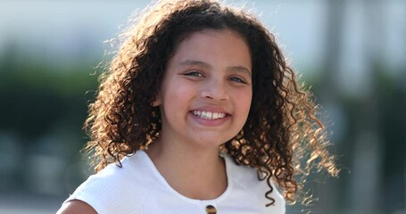 Pretty little girl child portrait smiling outside. close-up face smile - Powered by Adobe