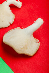 Fototapeta premium side view of fresh mushrooms isolated on red background