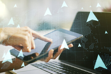 Creative abstract geolocations map sketch and hand working with a digital tablet on background, GPS tracking and navigation concept. Double exposure