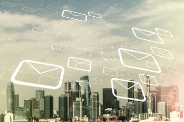 Double exposure of abstract virtual postal envelopes hologram on Los Angeles city skyscrapers background. Electronic mail and spam concept