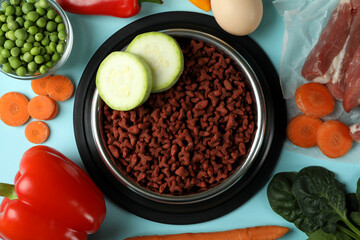Concept of organic pet food on blue background