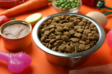 Concept of organic pet food on orange background
