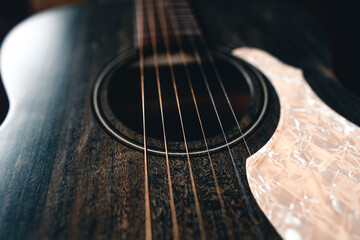 Wooden acoustic guitar On Hardwood Floor