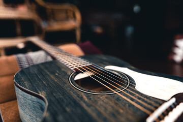 Wooden acoustic guitar On Hardwood Floor