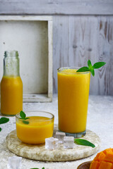 Fototapeta premium Mango Juice or jus mangga on white background. Fresh healthy during during summer holiday. 