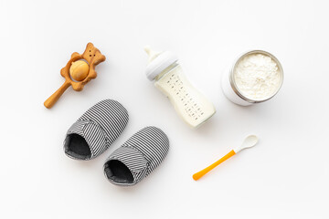 Baby bottle milk formula and powdered milk in a jar for baby feeding