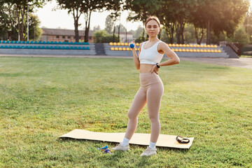 Full length portrait of slim woman with perfect body, brunette girl wearing beige leggins and white...