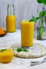Mango Juice or jus mangga on white background. Fresh healthy during during summer holiday. 