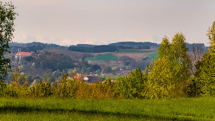 Obraz premium Beautiful spring view with a hazy far view of the alps at Bad Griesbach Therme, Bavaria, Germany