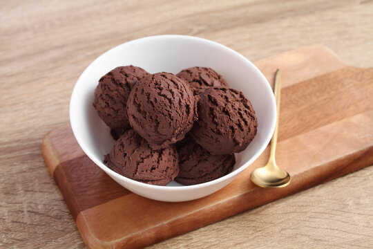 chocolate ice cream in white bowl on cutting board