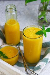 Mango Juice or jus mangga on white background. Fresh healthy during during summer holiday. 