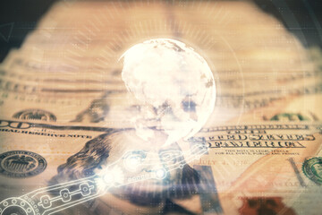 Double exposure of world map drawing over us dollars bill background. International concept.