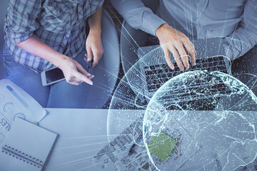 Double exposure of man and woman working together and social network theme hologram drawing. Computer background. connecting concept. Top View.