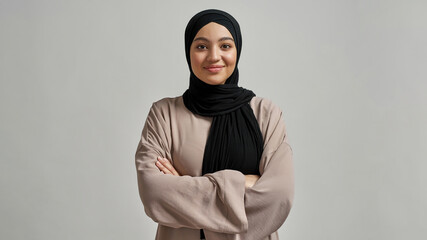 Portrait of smiling young arabian girl in black hijab - obrazy, fototapety, plakaty