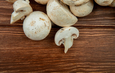 top view of fresh mushrooms isolated on rustic wooden background