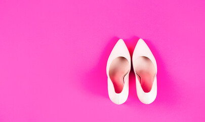 High heel women shoes on pink background. Shoe for women. Beauty and fashion concept. Fashionable women shoes isolated on red background. Stylish classic women leather shoe