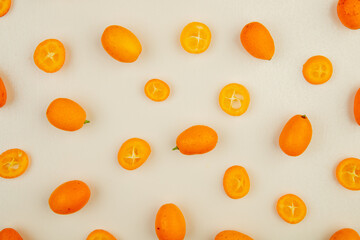 top view of fresh ripe kumquat fruits isolated on white background - obrazy, fototapety, plakaty