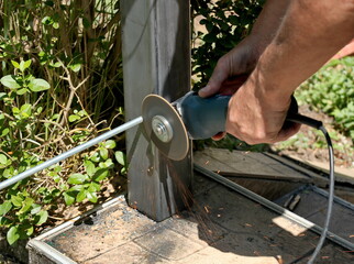 Welder works in cutting and  processing of steel components