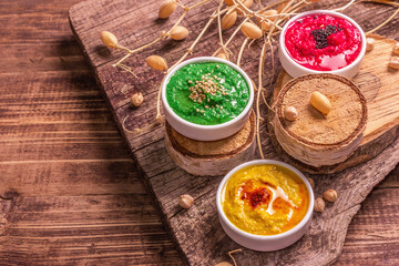 Chickpea hummus backdrop, assorted flavor on vintage wooden table
