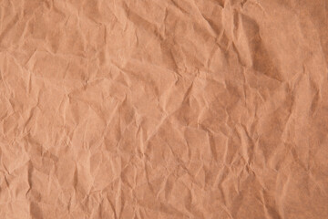 Crumpled recycled brown paper texture background