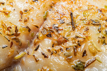 Fried fish in oil with herbs and spices with homemade fried potato. Simple, homemade food.