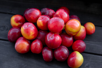 Fototapeta na wymiar Ripe cherry plum on a black background