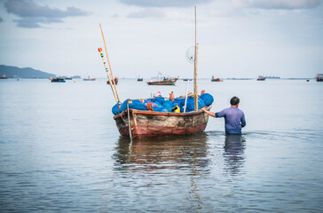 Local fishermen are about to take a boat out to sea to fish at Ban Bang Phra, Thailand
