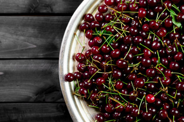 Ripe cherries on wooden background