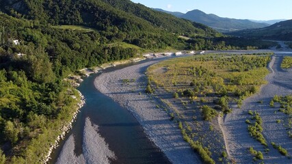 Italy, Bobbio , Piacenza , Val Trebbia - drought in the river - decrease in river water level caused by the melting of glaciers - the  Apennines countryside landscape with hills -Drone aerial view