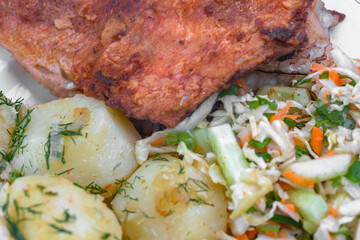 Fried fish with garnish and salad