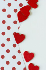 halftone polka dots and hand-painted red hearts on a light background with some space for text