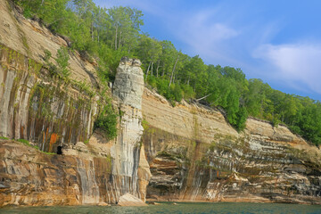 Fototapeta na wymiar Landscape of the mineral stained, sandstone and eroded shoreline of Lake Superior, Pictured Rocks National Lakeshore, Michigan's Upper Peninsula, USA