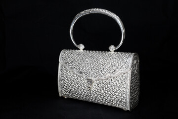 Luxury silver handbag on black background, Beautiful silver purse isolated on black background