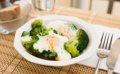 breakfast of crumpled eggs with broccoli