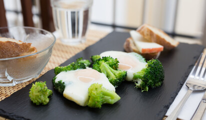 breakfast of crumpled eggs with broccoli