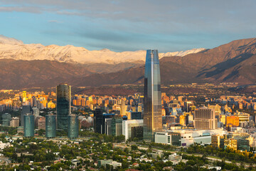 Skyline of Santiago de Chile at the foots of The Andes Mountain Range and buildings at Providencia...