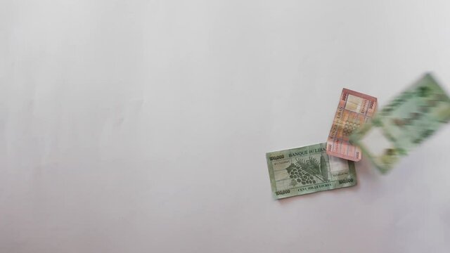 Lebanese Lira currency bills with 100 USD dollars