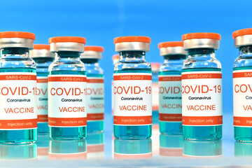 Corona virus vaccine Covid-19 on glass table.