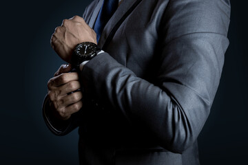 Fototapeta premium Businessman checking time on watch