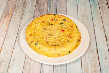 Great whole Spanish potato omelette with vegetables and egg juice and virgin olive oil.