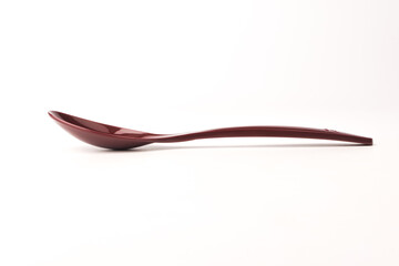 plastic spoon on a white background