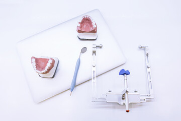On the table at the dentist or orthodontist. Dentist's work items. Concept photo for the dentist. Dental mirror and dental layout.