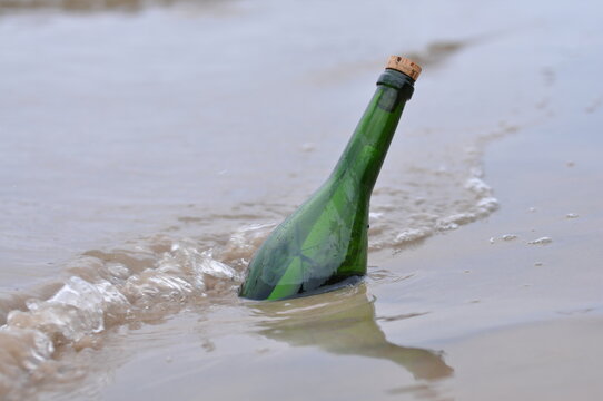 Message in bottle on sandy beach