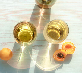 Glasses of lemonade with apricots. Top view of glasses with lemonade and fruit of apricot. Caustic...