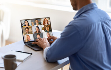 Teleconference Concept. Businessman Joined Video Call With Colleagues On Laptop In Office