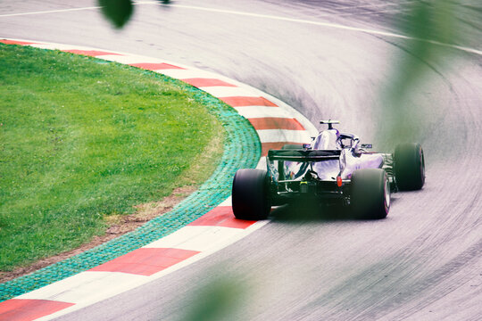 F1 race car on the racing track, driving into the corner, GP, Grand Prix, Formula One racing car