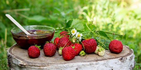Strawberry jelly, jam on a wooden background, environmentally friendly product.