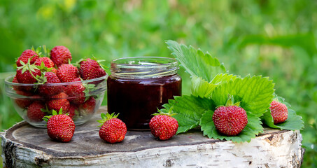 Strawberry jelly, jam on a wooden background, environmentally friendly product.